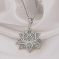 Silver plated lotus flower pendant with detailed, engraved line work and an ornate outline. The pendant hangs from a delicate silver chain.