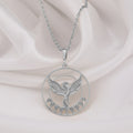 Phoenix Rising Necklace: Sterling silver pendant showing a phoenix within a circular frame and leaf border.