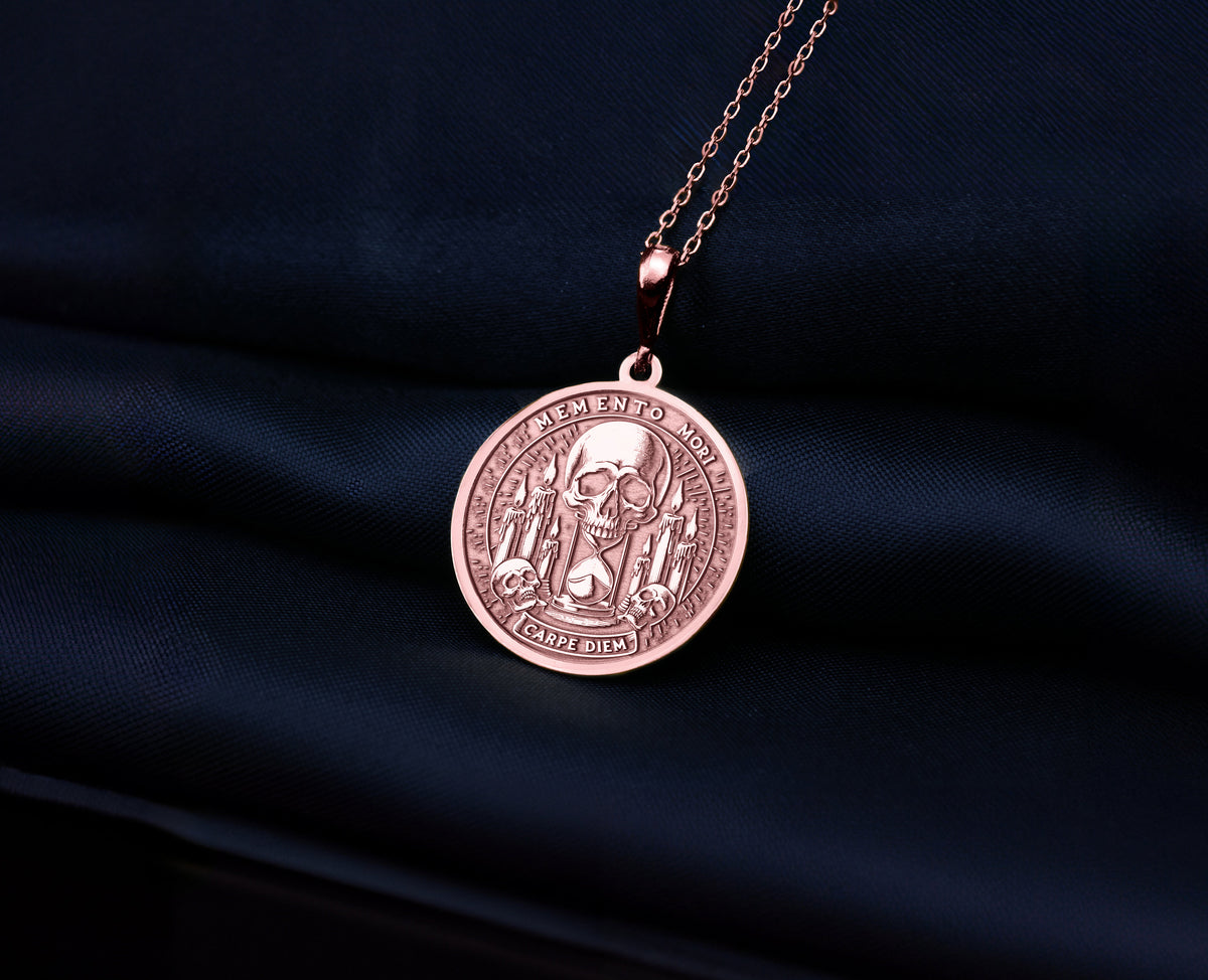 Gothic Skull Memento Mori Necklace Necklaces 14K Rose 14K 14K Rose Gold Plated skull pendant necklace with detailed engraving on dark blue fabric.