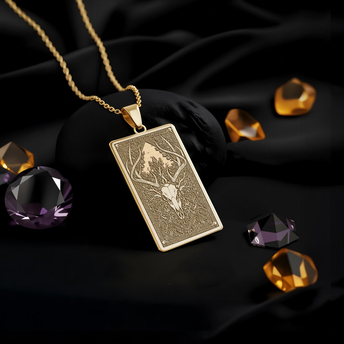 Forest God Deer Skull Pendant Necklaces 14K 14K Gold Plated rectangular pendant necklace with engraved animal head design and loose purple and amber stones.