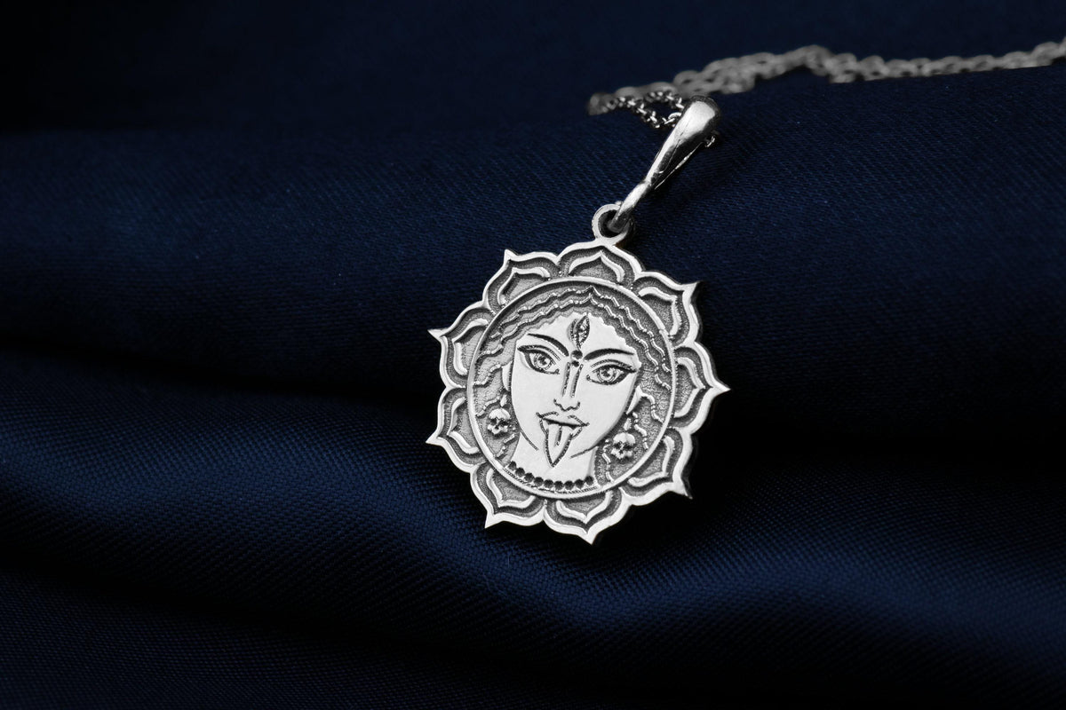 Durga Warrior Goddess Amulet Necklace Necklaces 925 925 Sterling Silver metal pendant with a stylized face in a circular mandala frame necklace