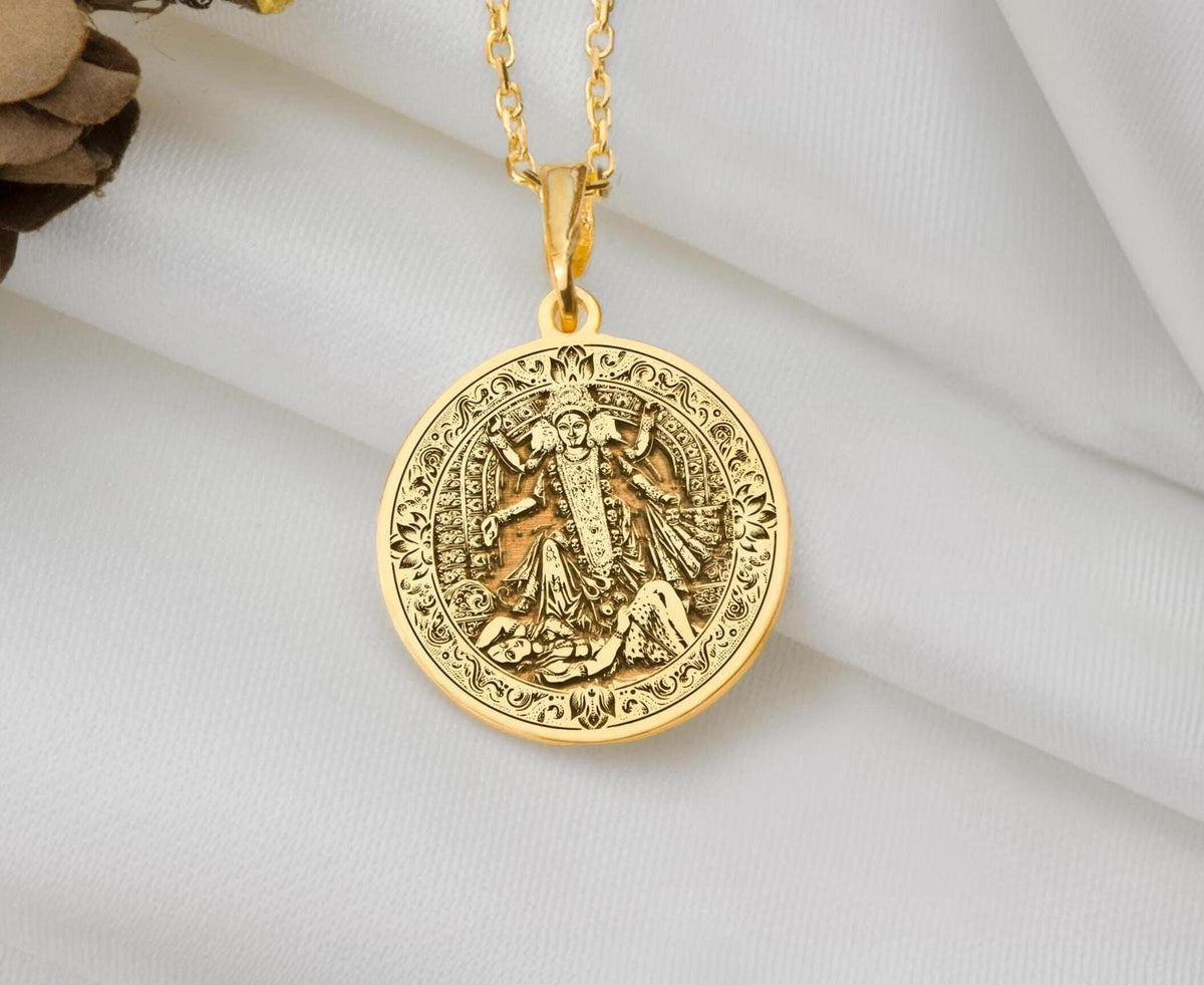 Kali Ma Memento Mori Pendant Necklaces 14K 14K Gold Plated round pendant with classical religious figure design on white fabric background