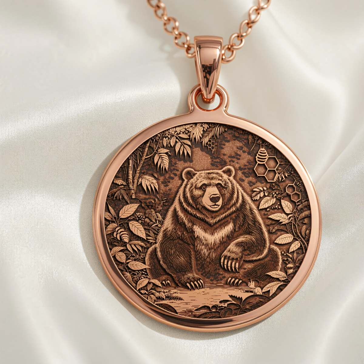 Jungle Bear Spirit Animal Pendant in 14K rose gold plated, front view showing engraved seated bear surrounded by jungle foliage and honeycomb.