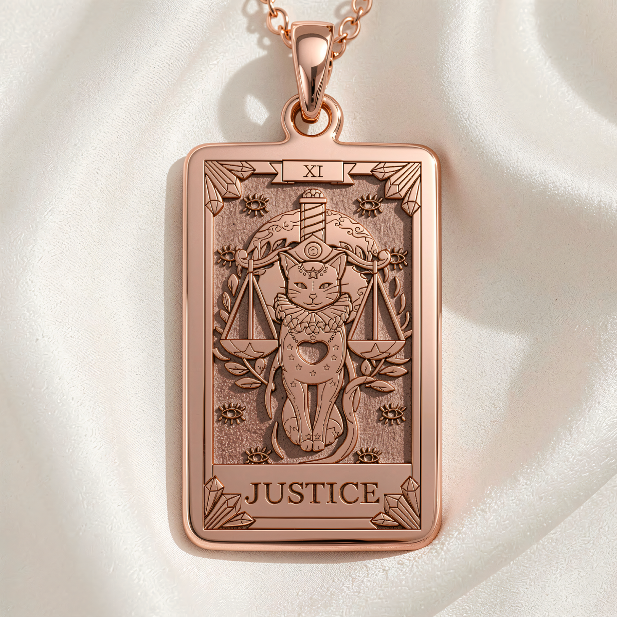 Justice Tarot Arcana Necklace rose gold plated front view of rectangular pendant with engraved cat holding scales, Roman numeral XI, and JUSTICE text.
