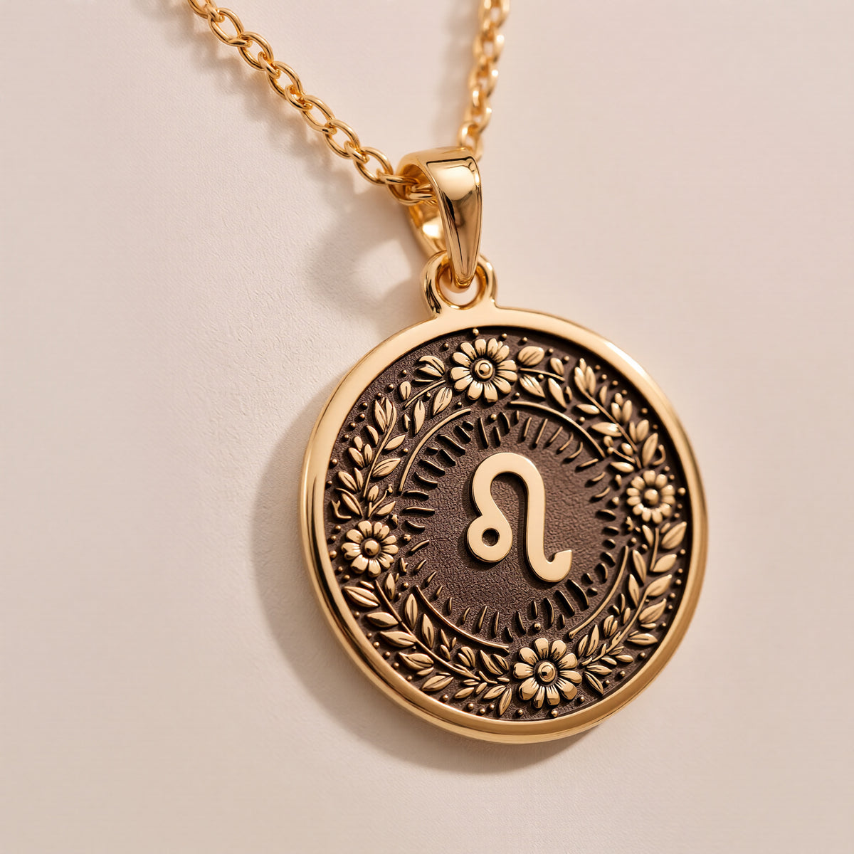 Leo Zodiac Astrological Sign Medallion Necklaces Gold-toned round pendant necklace options featuring engraving choices in 14K Gold or 14K Gold Plated.