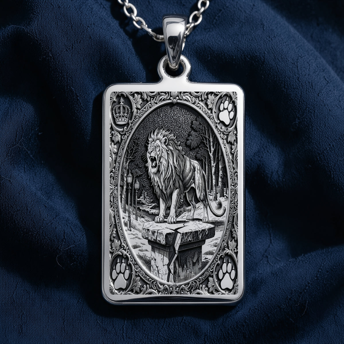 Silver pendant featuring a detailed Lion King of Beasts design with an ornate border and textured surface finish. The pendant is displayed on a black background with several faceted gemstone-like shapes scattered around it.