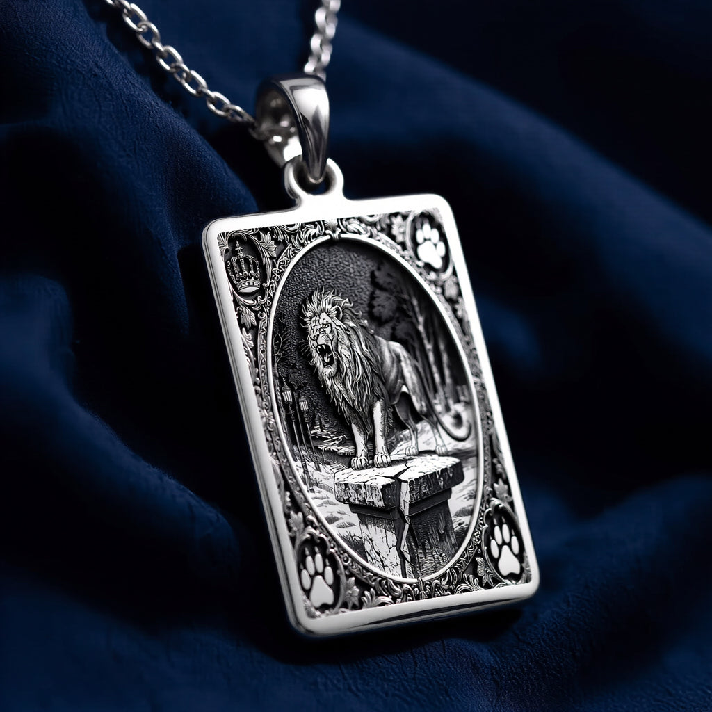 Silver pendant featuring a detailed Lion King of Beasts design with an ornate surface finish. The pendant is attached to a delicate chain, shown from a slight angle against a dark background.
