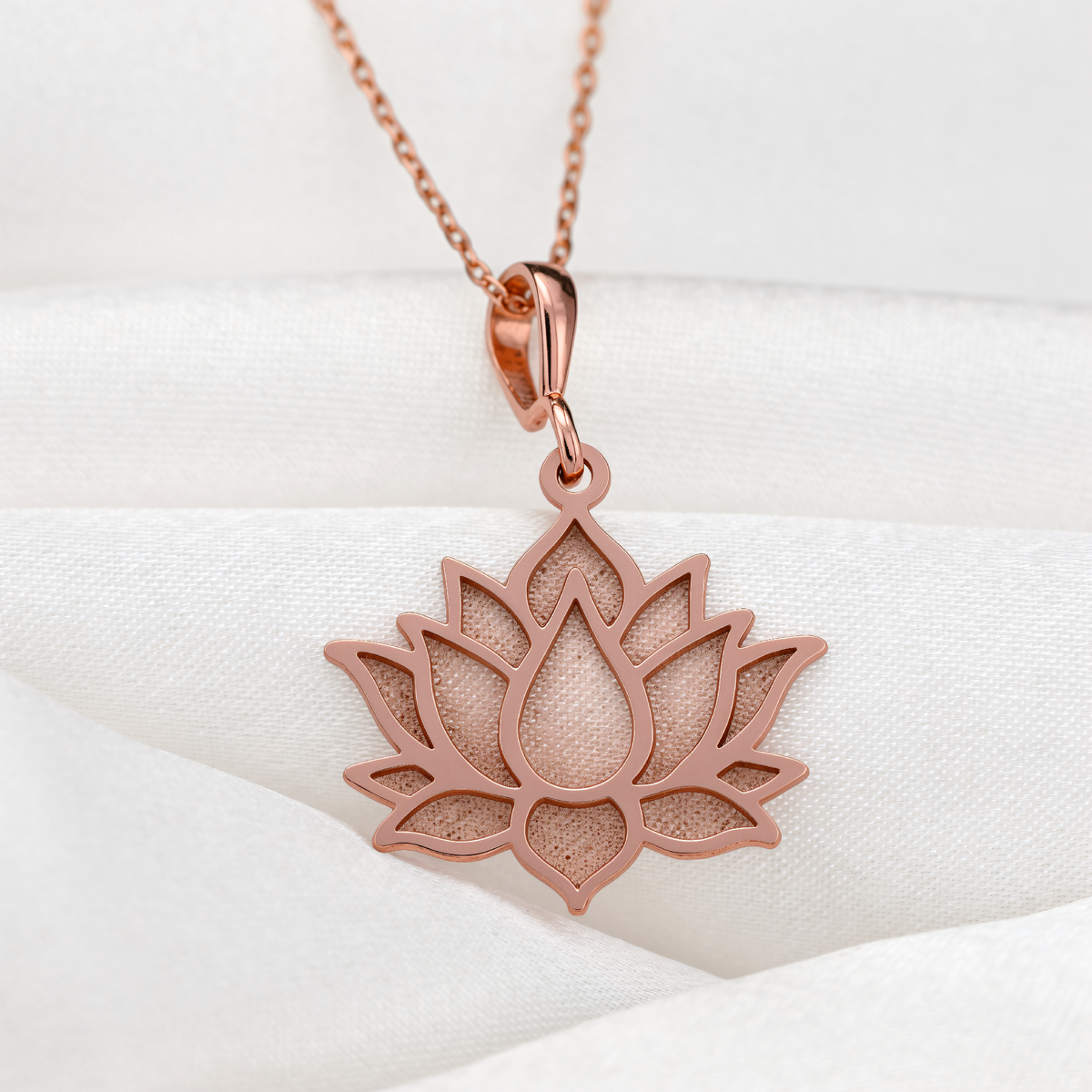 Lotus Flower Unfolding Petals Pendant in a polished rose gold finish.