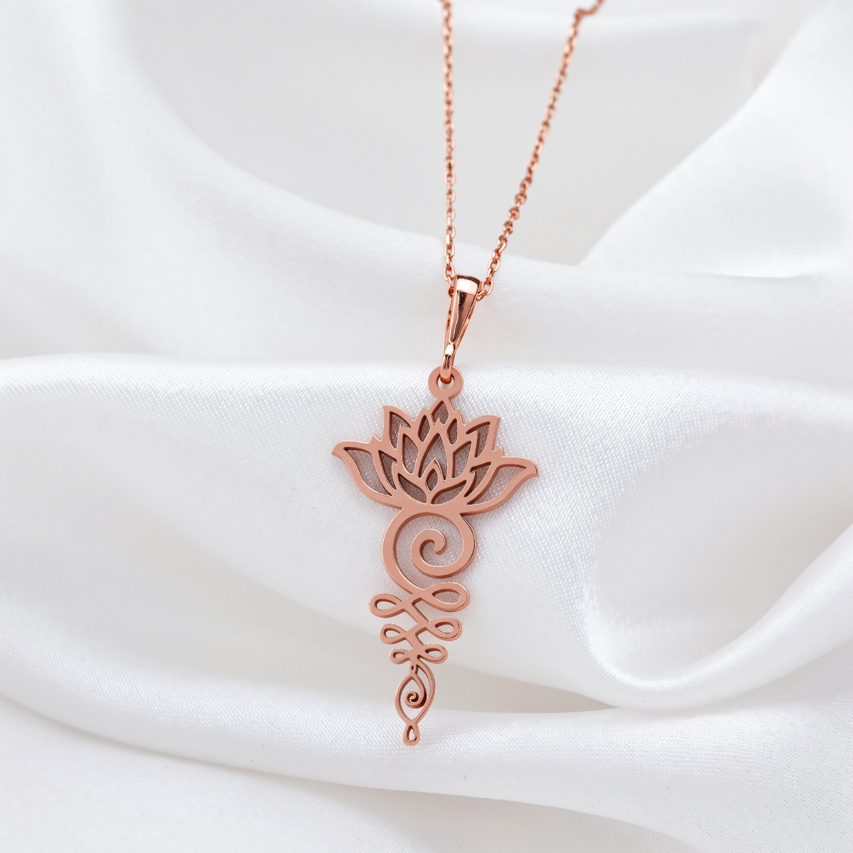 Lotus Flower Yoga Talisman Necklace in a polished rose gold finish.