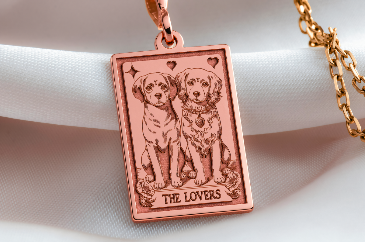 The Lovers Puppy Card Necklace in a polished rose gold finish.