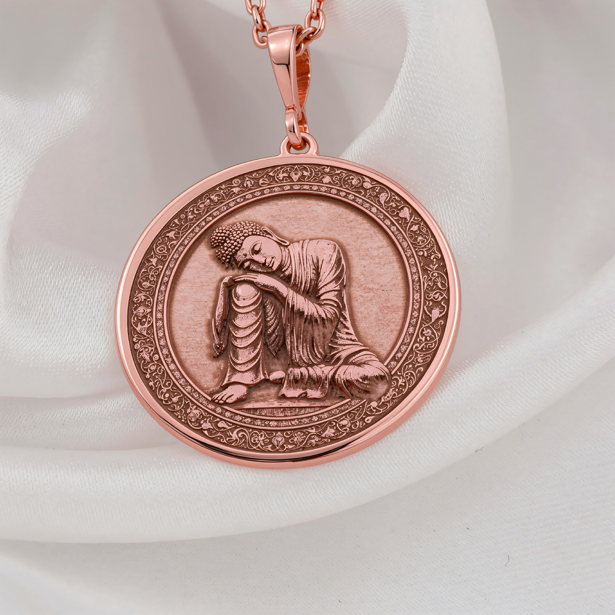 Meditating Buddha Necklace in a polished rose gold finish.