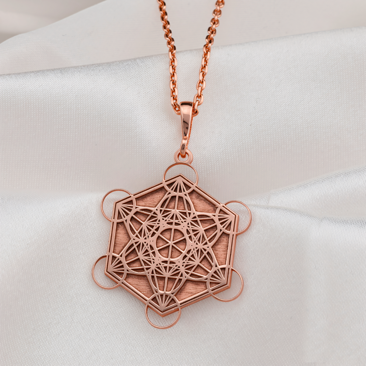 Metatron's Cube Sacred Geometry Necklace in a polished rose gold finish.