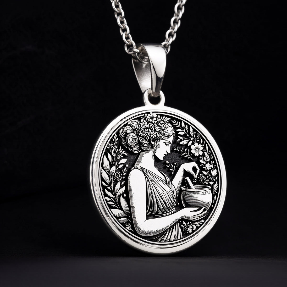 925 Sterling Silver Panacea Pendant with medallion design. Handcrafted silver coin charm with detailed Greek healing goddess profile and botanical border. Medicine symbol necklace featuring health deity, perfect medical professional gift.