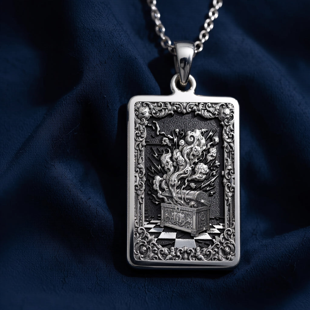 Silver rectangular pendant necklace featuring an ornate, detailed frame design with intricate scrollwork. The pendant is attached to a silver chain and displayed among faceted gemstones. - View 5