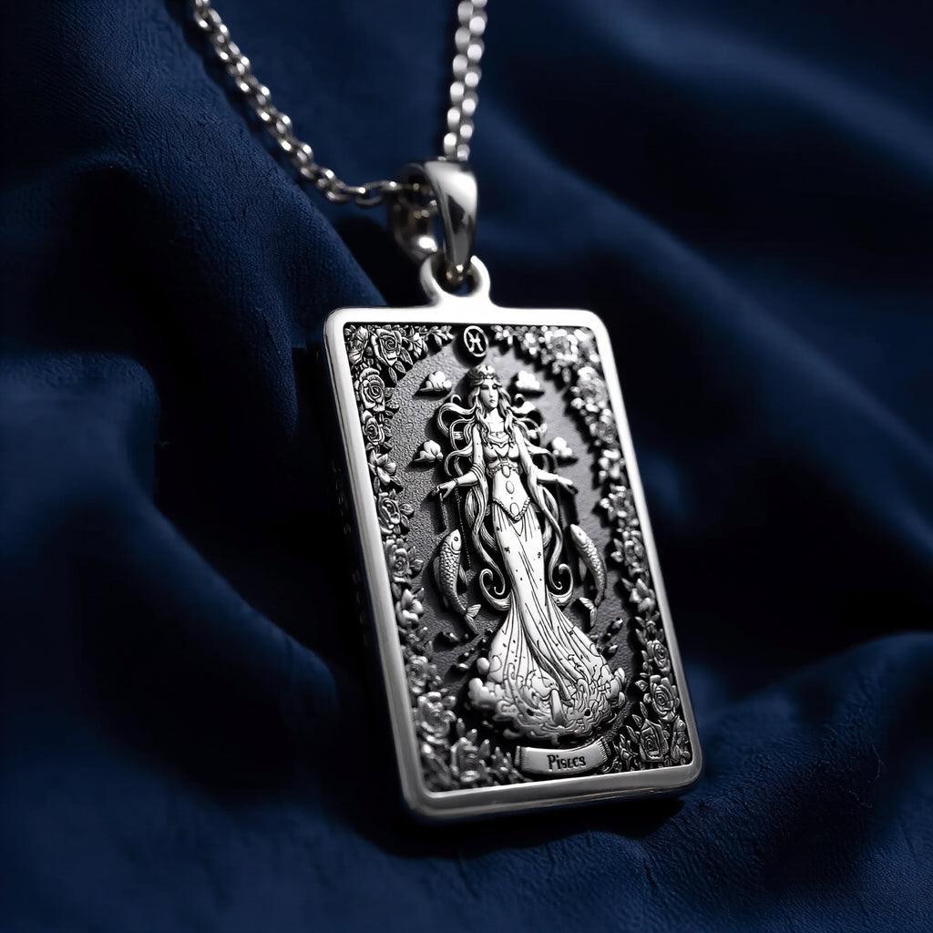 Silver plated rectangular pendant with fine detailing of a classical figure within an elaborate border. The necklace features a silver chain and is presented against a soft background. - View 6