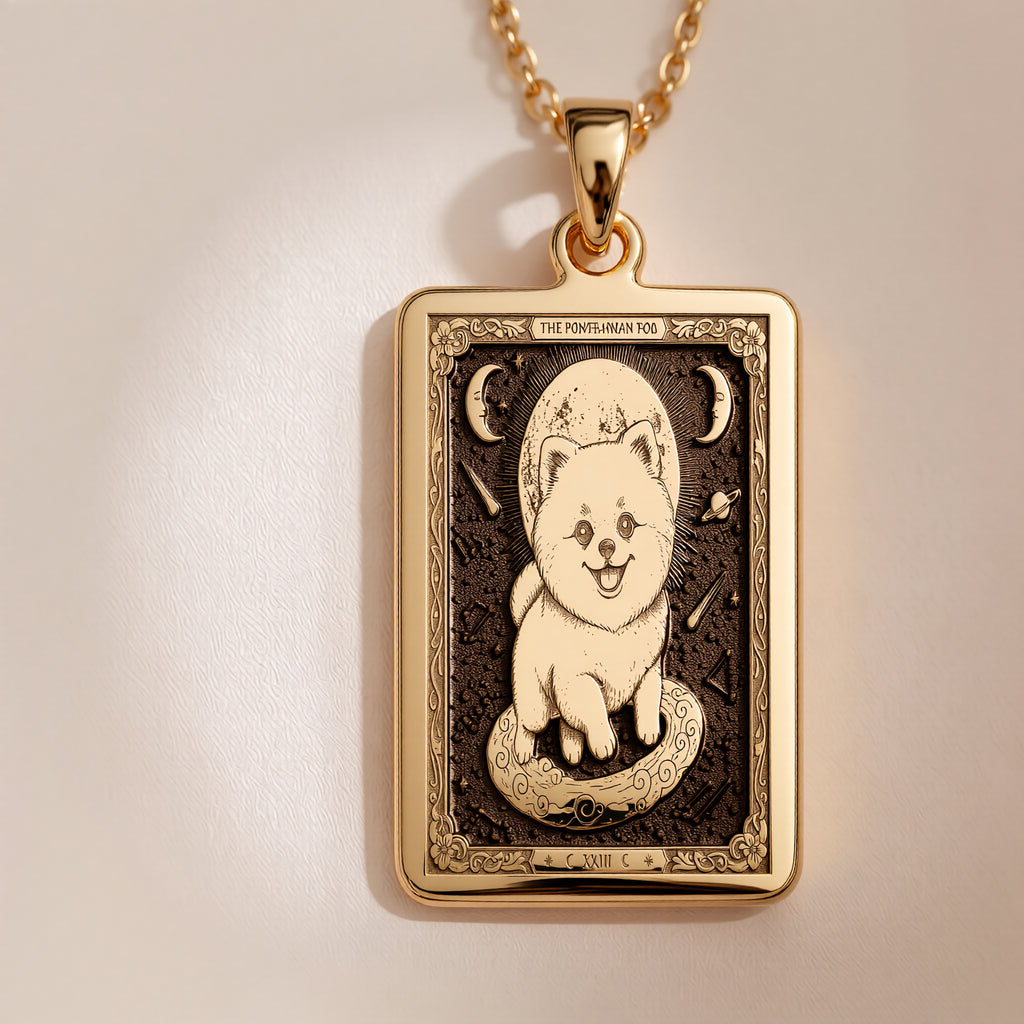 An heirloom-quality 14K solid gold Pomeranian Boo tarot pendant. The art shows the teddy bear dog on a moon, symbolizing its sweet nature, a precious dog mom gift.