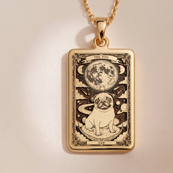 An heirloom-quality 14K solid gold Pug tarot pendant. The art shows the comical dog under the moon, symbolizing its big heart, a precious dog mom gift.