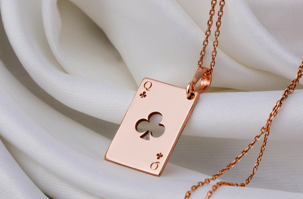 Queen of Clubs Poker Card Necklace in a polished rose gold finish.