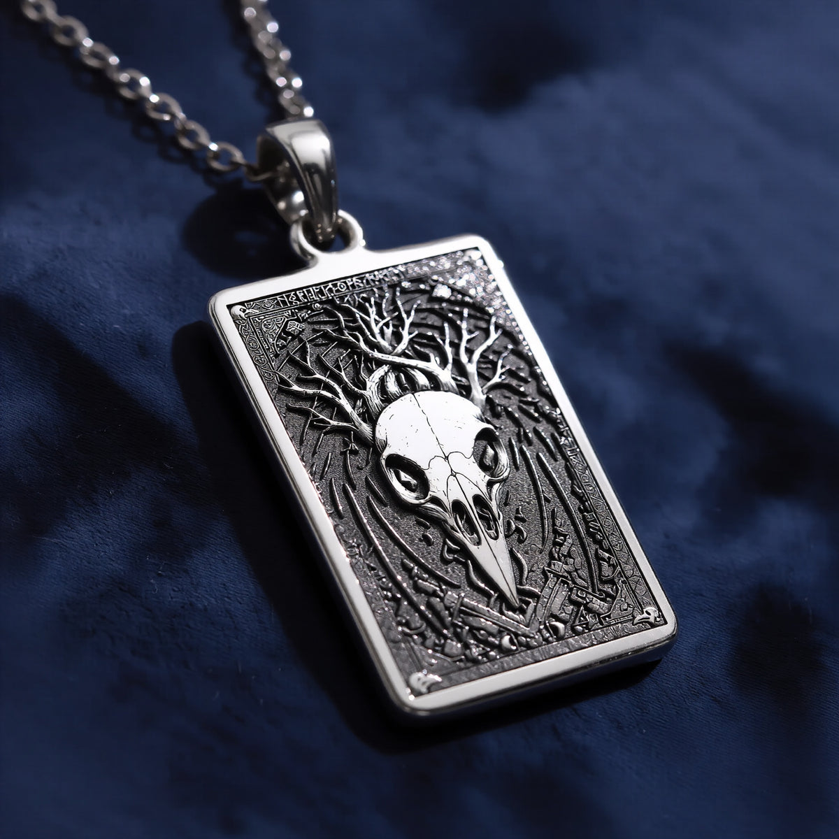 Silver raven skull pendant necklace with a gothic style design and a polished surface finish. The view is a close-up of the pendant, showing intricate details suitable for a memento mori aesthetic.