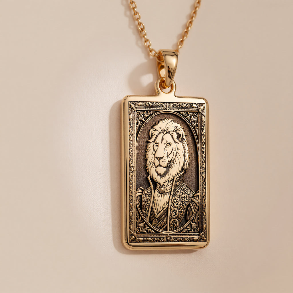An heirloom-quality 14K solid gold rectangular pendant engraved with a majestic lion. This fine jewelry piece from the Fable Character collection is inspired by the great lion Aslan from The Chronicles of Narnia.
