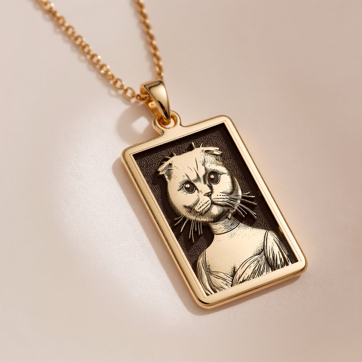Product photo of a 14K Solid Gold Scottish Fold necklace from the 'Victorian Pet Collection'. The engraved cat is portrayed as a noble lady in a Regency-style dress.