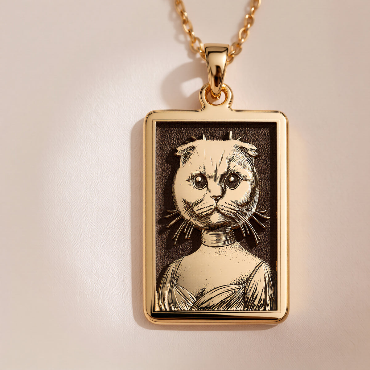 A slightly angled view of the 14K Solid Gold Scottish Fold pendant, highlighting the polished finish on the frame and the cat's distinctive folded ears.