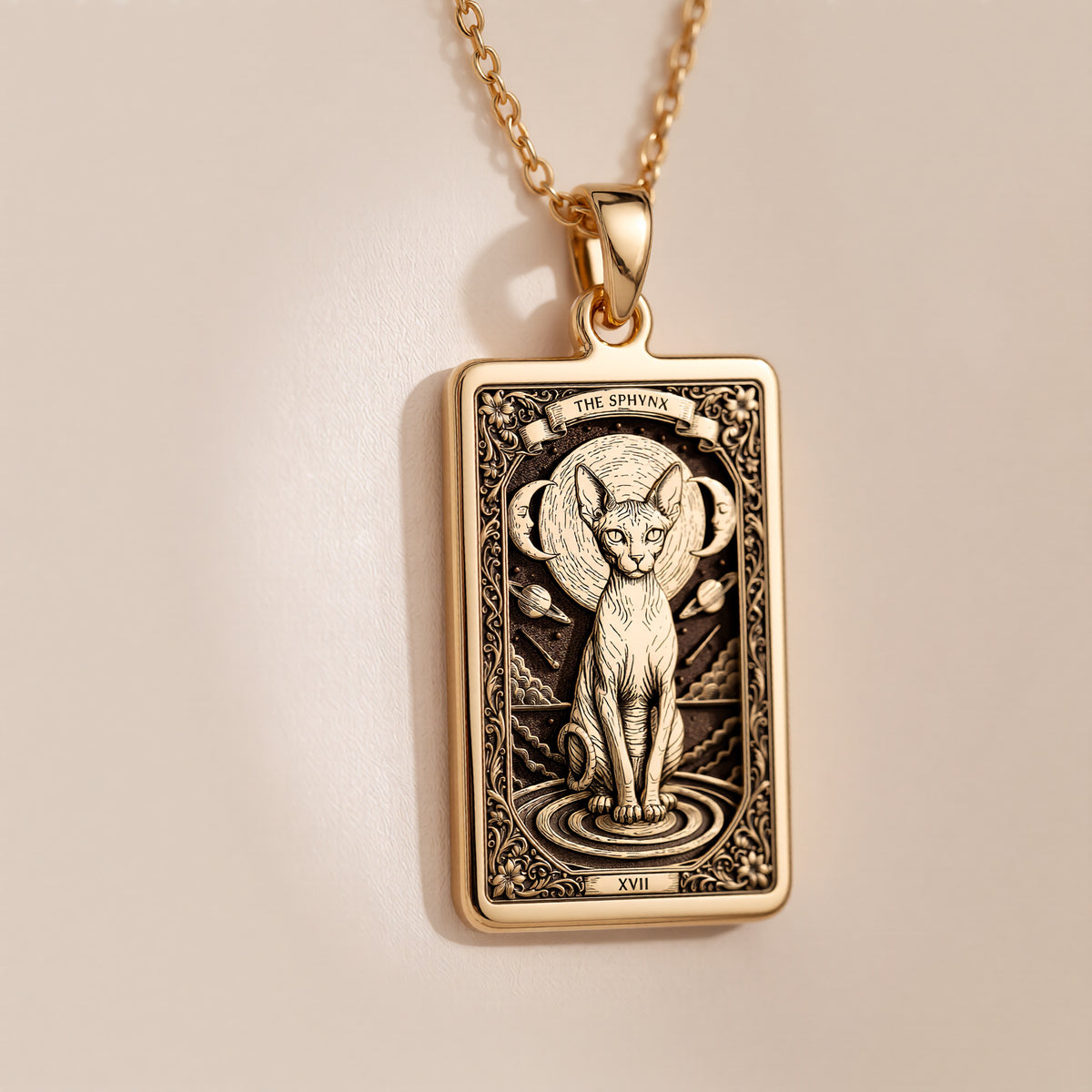 A polished 14K solid gold Sphynx Cat medallion. This fine pet jewelry represents the breed's unique beauty, making it a perfect witchy gift.
