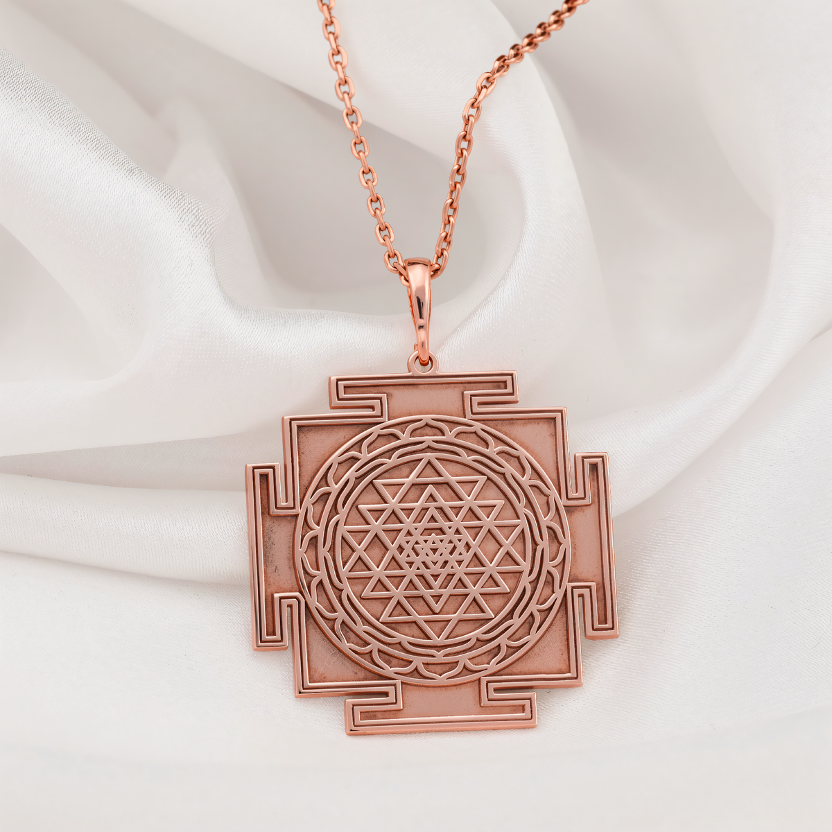 Sri Yantra Sacred Geometry Pendant in a polished rose gold finish.