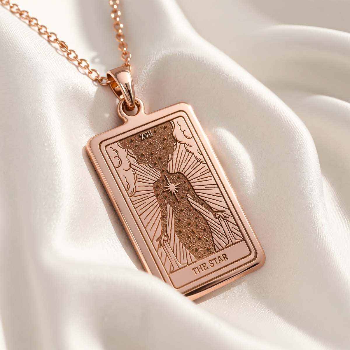 The Star Tarot Necklace rose gold plated pendant showing the engraved figure pouring water under a radiant star.