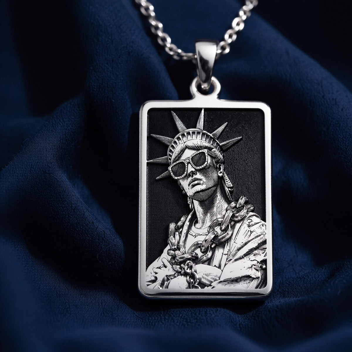 Silver plated rectangular pendant featuring a detailed classical figure with a crown motif and draped fabric. The pendant is attached to a silver chain and shown in an overhead view. - View 4