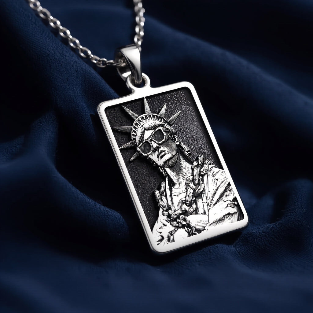 Silver plated rectangular pendant featuring a detailed classical figure with a crown motif and draped fabric. The pendant is attached to a silver chain and shown in an overhead view. - View 7