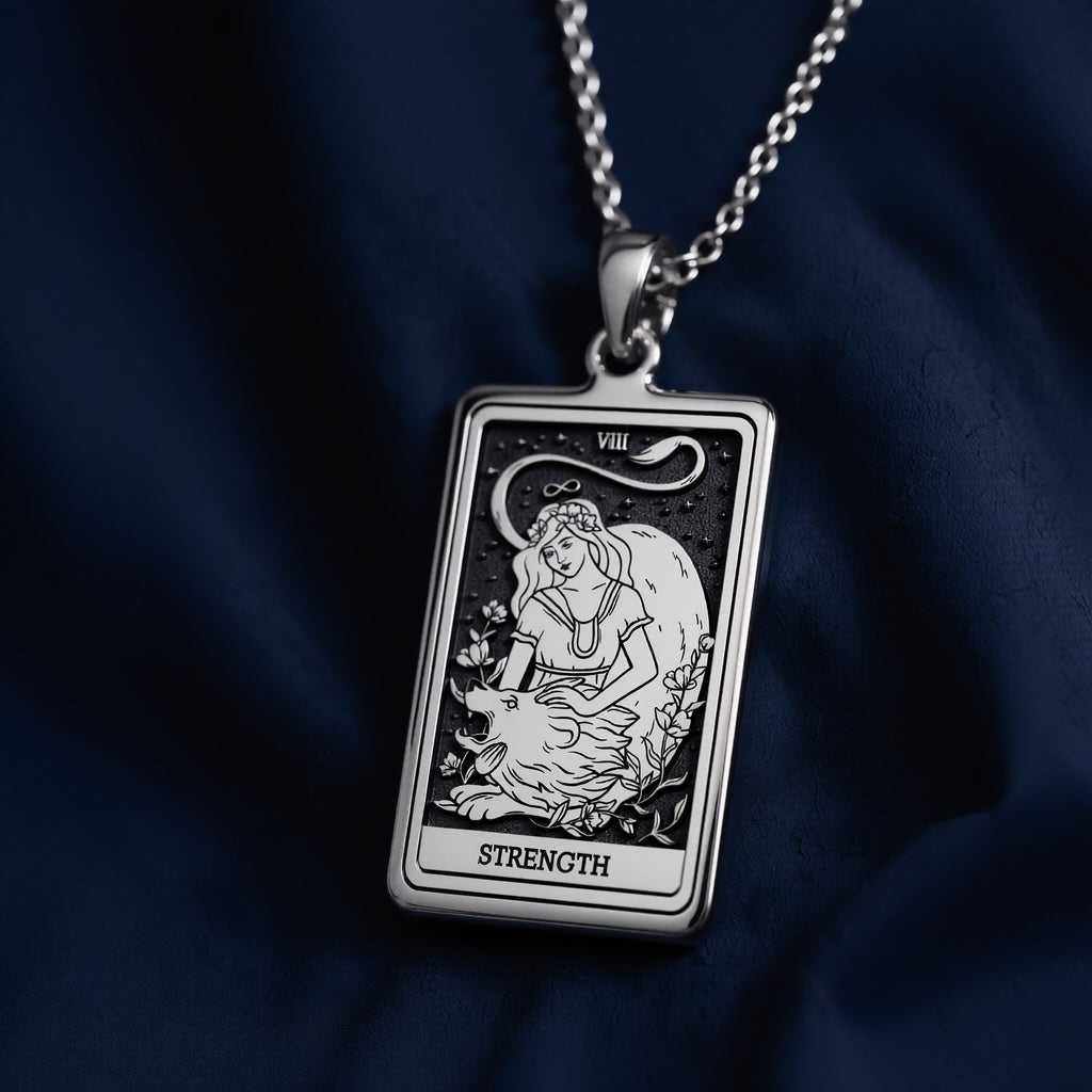 Silver pendant necklace featuring a rectangular design of the Strength Tarot Arcana card with intricate line art. The pendant has a polished finish and is attached to a silver chain. - View 7