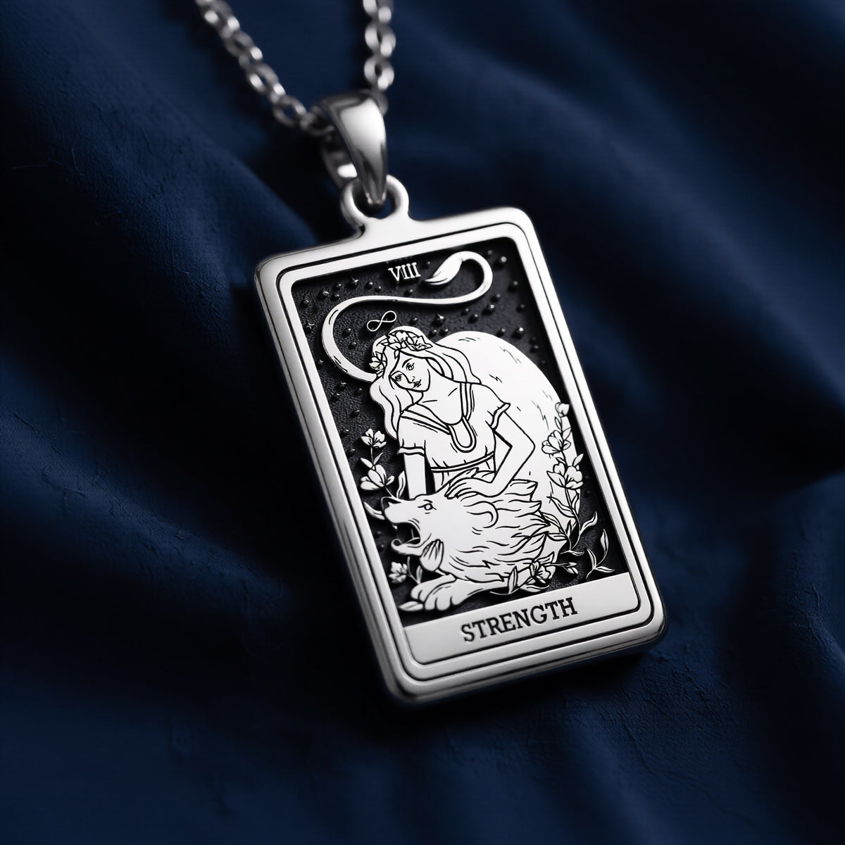 Silver pendant necklace featuring a rectangular design of the Strength Tarot Arcana card with intricate line art. The pendant has a polished finish and is attached to a silver chain. - View 8