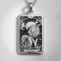 Silver plated pendant necklace featuring the Strength Tarot card motif. The pendant is attached to a silver chain and displays fine engraved details of the card illustration.