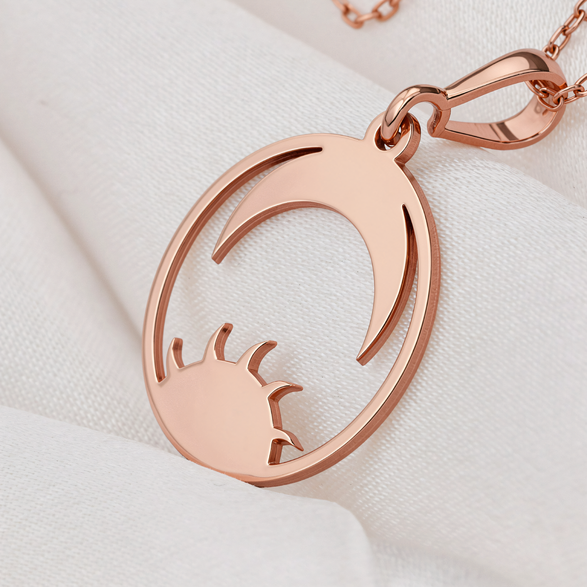 Sun Moon Celestial Necklace in a polished rose gold finish.