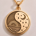 Sun & Moon Celestial Pendant: 14K solid gold circular medallion showing a sunrise over water and a crescent moon with stars.