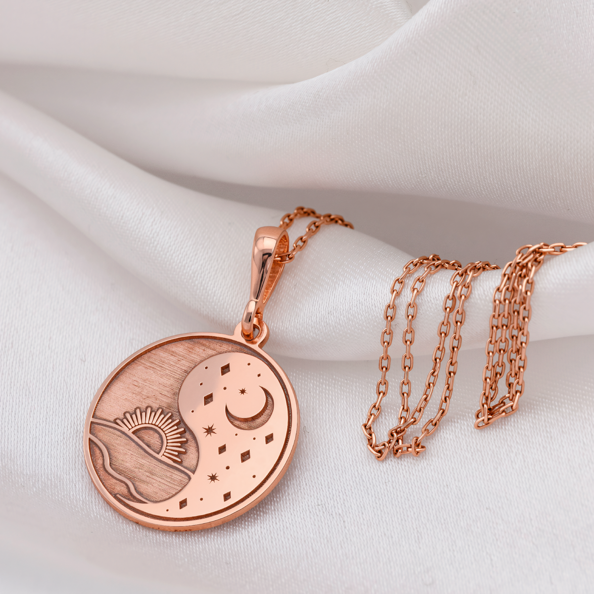 Sun & Moon Celestial Pendant in a polished rose gold finish.