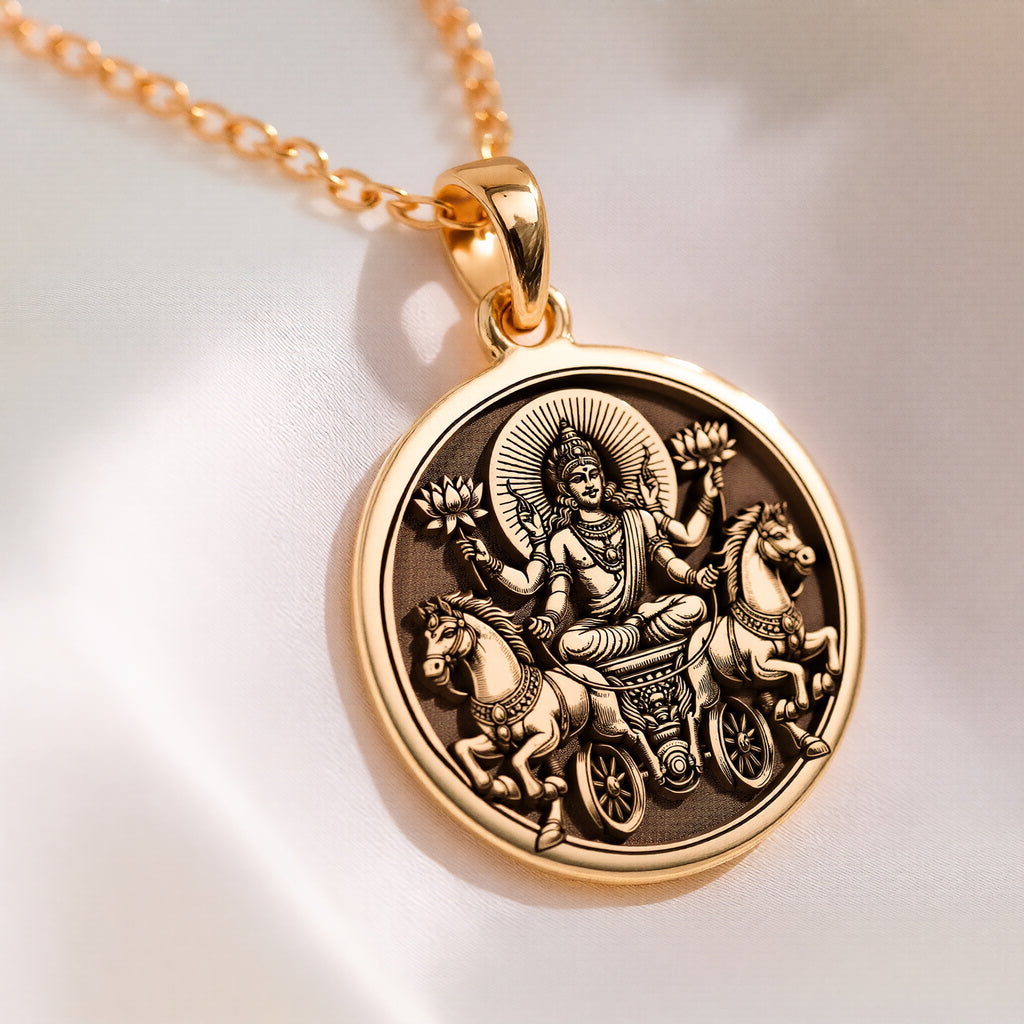 Surya Sun God Necklace: 14K solid gold pendant featuring Surya riding his two-horse chariot with lotuses and halo.