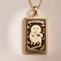 An heirloom-quality 14K solid gold Pomeranian tarot pendant. The art shows the fluffy dog in a "Sun" card, symbolizing a sunny personality, a precious dog mom gift.