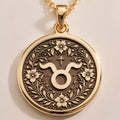 14K Solid Gold Taurus Zodiac Medallion with Taurus symbol (♉) and floral wreath. A perfect personalized gift with optional back engraving. Detailed celestial horoscope jewelry for astrology lovers.