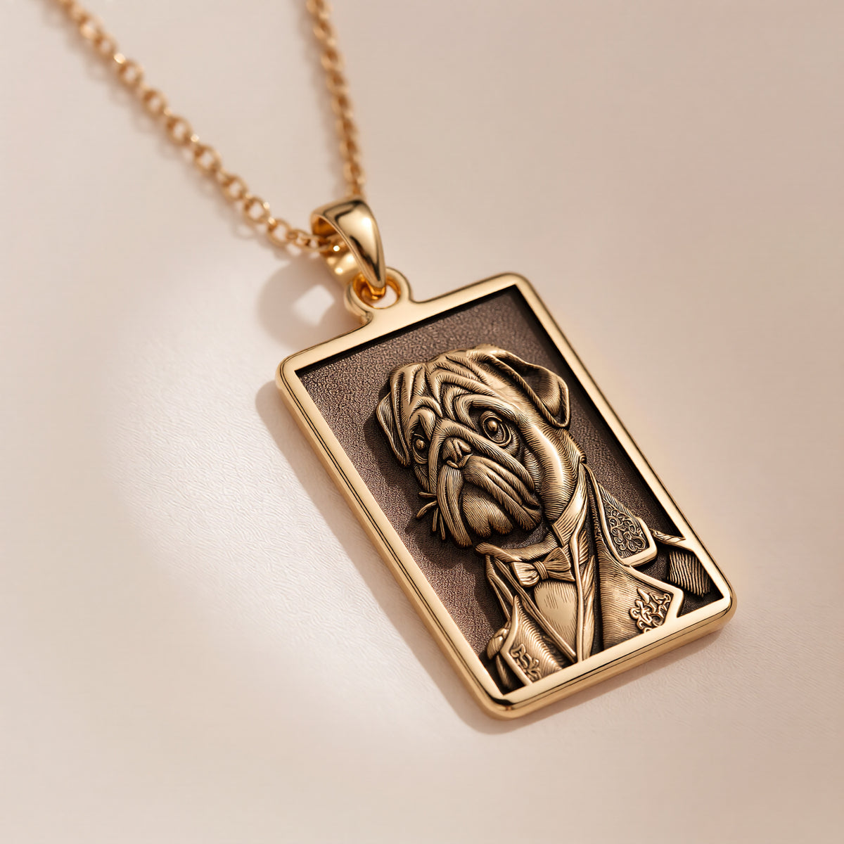 A rectangular 14K gold plated pendant necklace featuring a detailed laser engraving of a distinguished Pug dog in a Victorian suit.