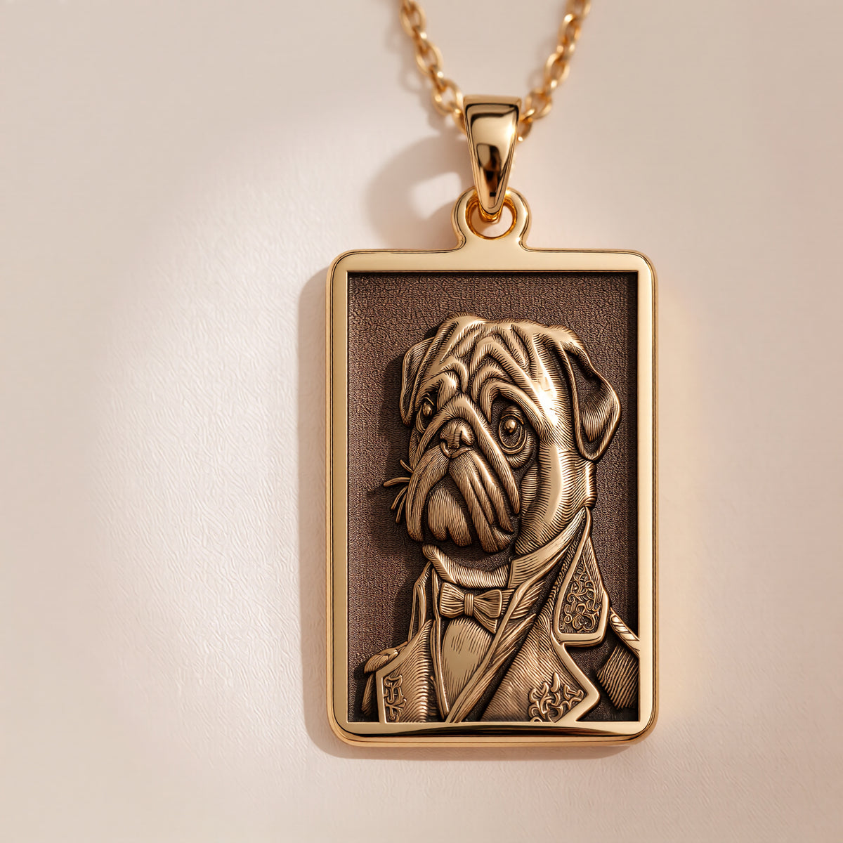 Close-up of a custom engraved 14K gold plated necklace showing an anthropomorphic Pug portrait, a perfect quirky gift for a Pug dad.