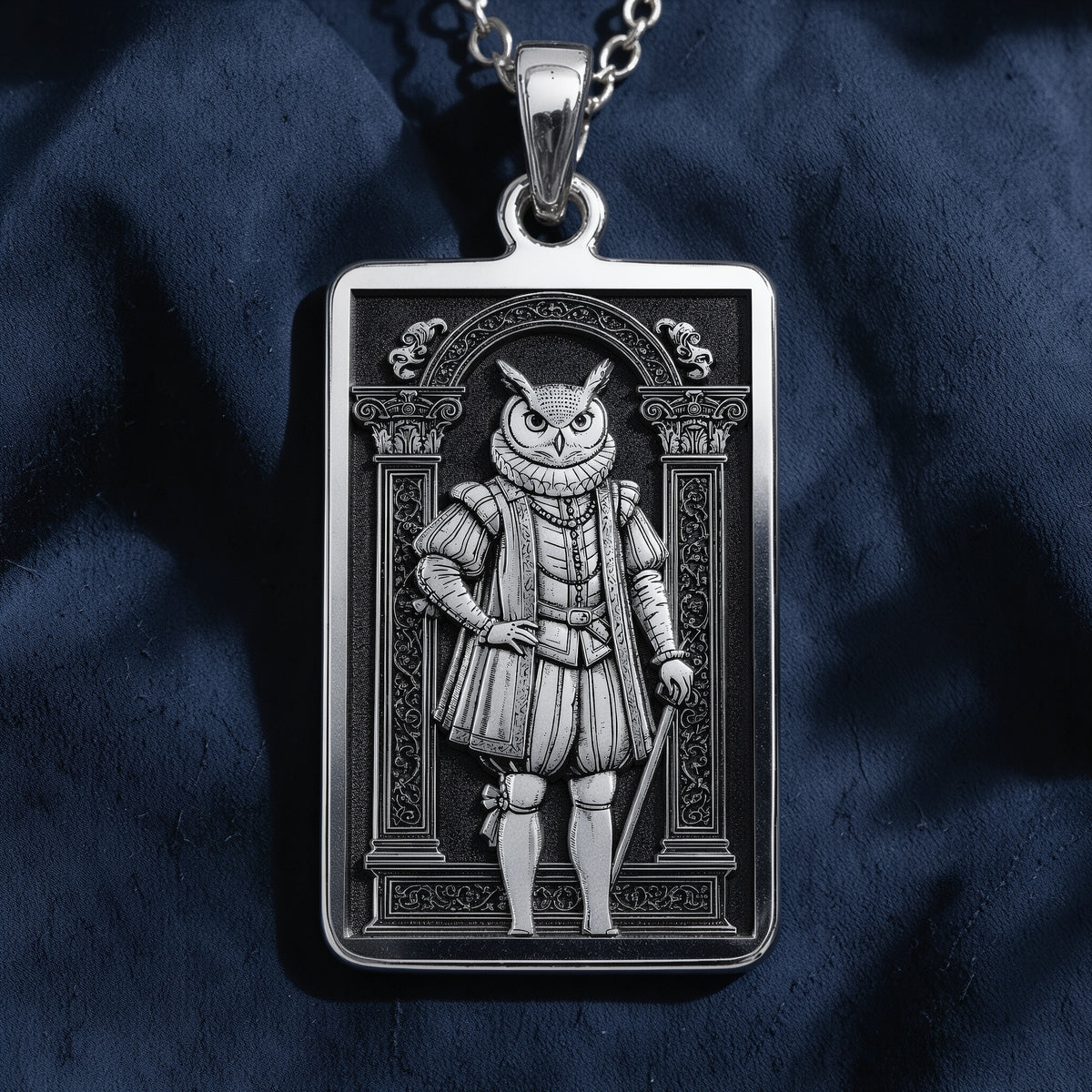 A handcrafted 925 sterling silver wise owl charm in a rectangular shape. This personalized piece of anthropomorphic jewelry is a standout accessory for any admirer of the symbol of wisdom.