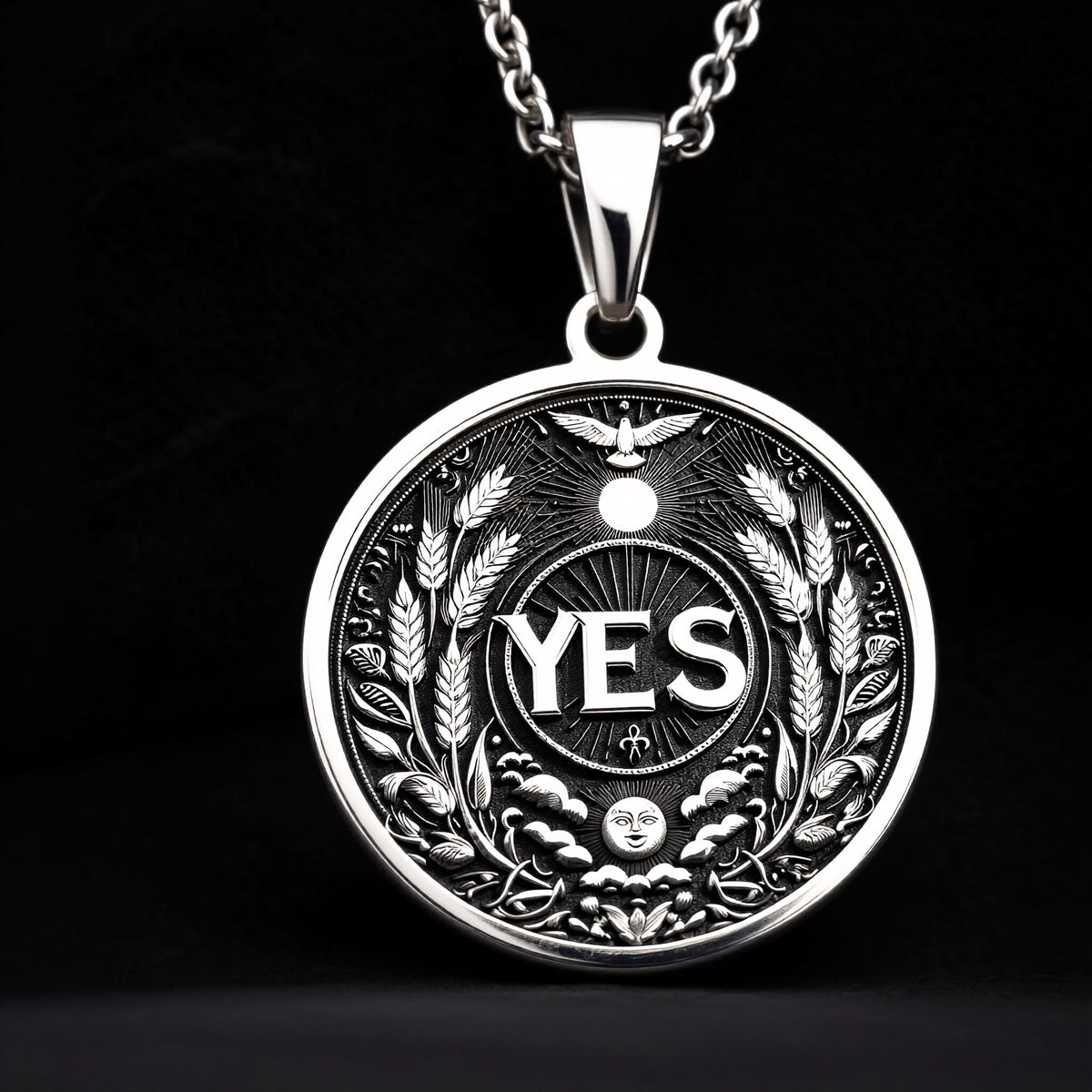 925 Sterling Silver YES Pendant with detailed affirmation design. Handcrafted silver coin charm featuring empowering word surrounded by wheat, celestial elements and flying bird. Motivation jewelry celebrating positive decisions and new beginnings.
