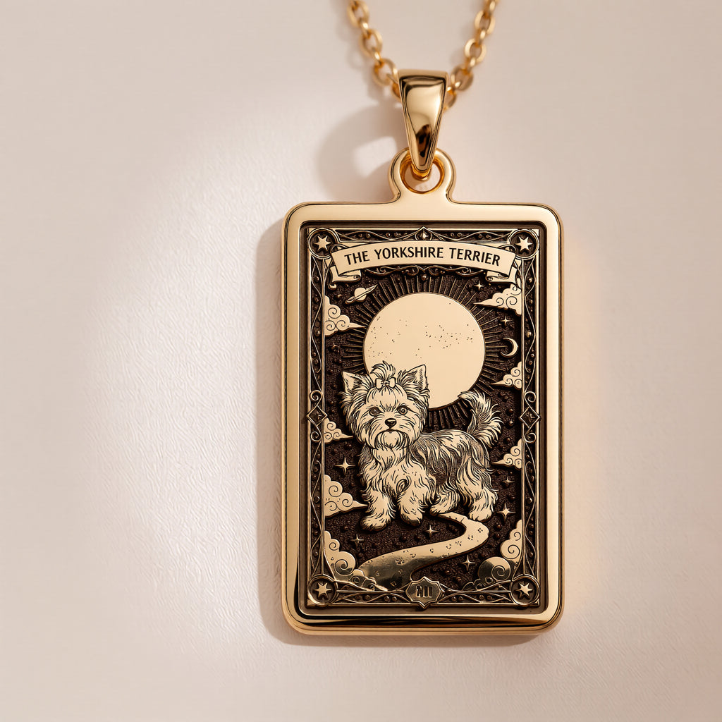 An heirloom-quality 14K solid gold Yorkshire Terrier tarot pendant. The art shows the sassy dog under the moon, symbolizing its big spirit, a precious dog mom gift.